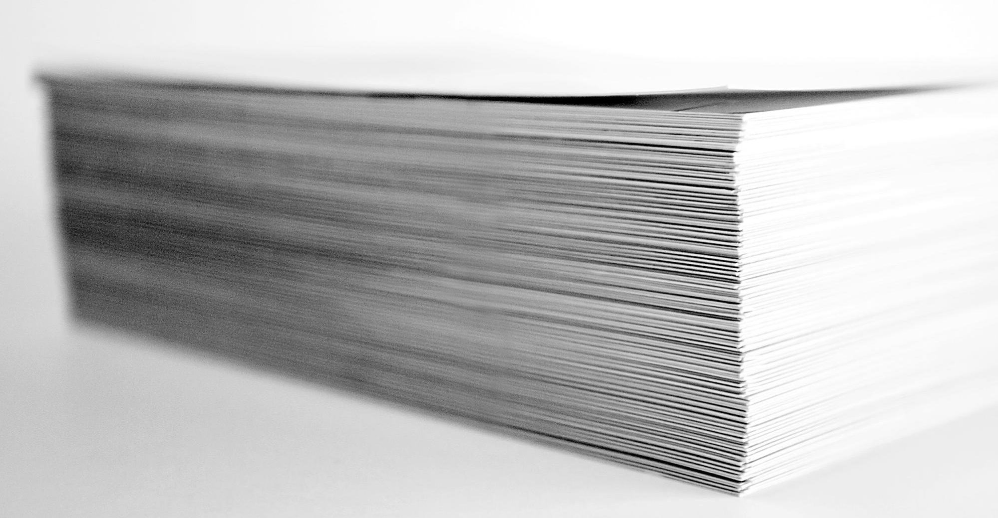 Close up of a stack of white paper