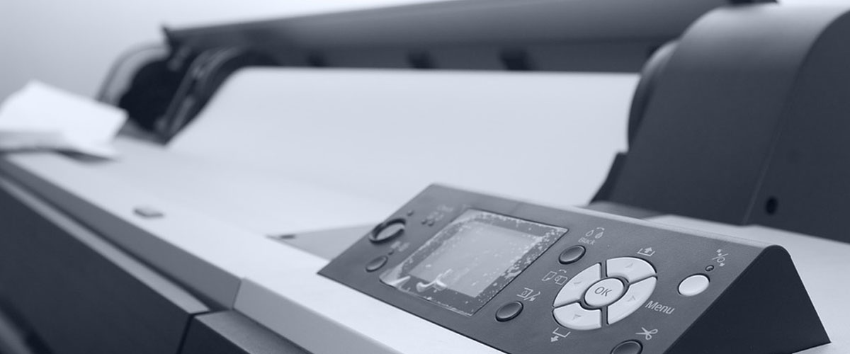 A multi-purpose printer close up in black and white