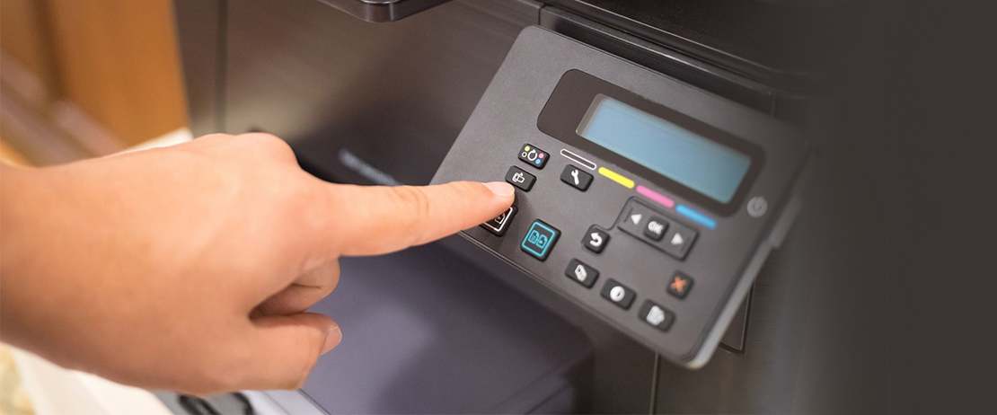 A person operating a printer