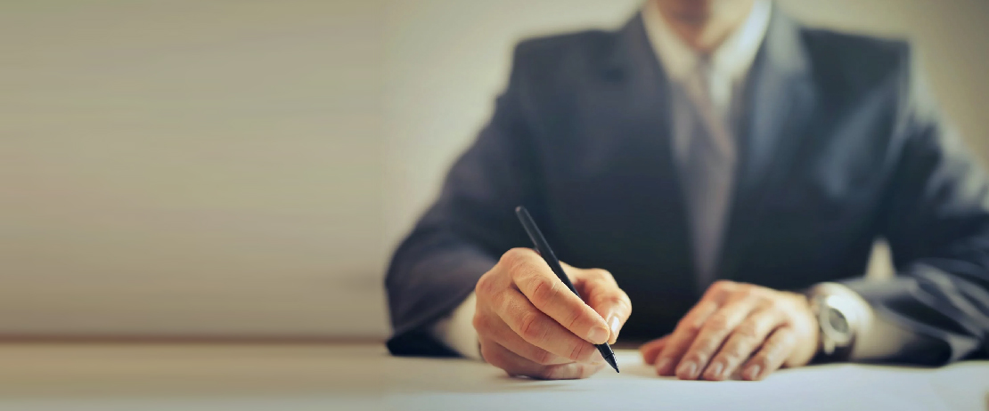 A lawyer signing a document