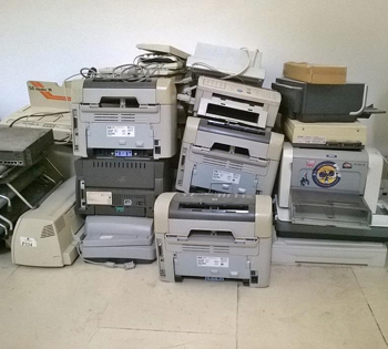A pile of old printers