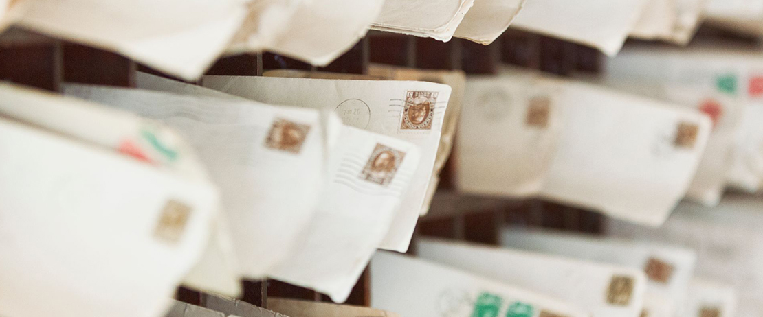 Various mail with stamps in cubbyholes