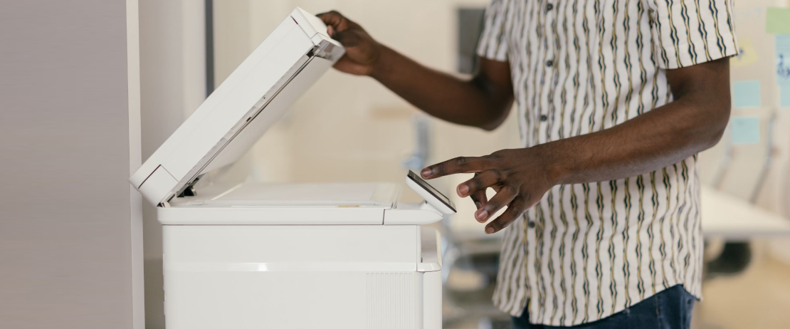  A man using a copier machine