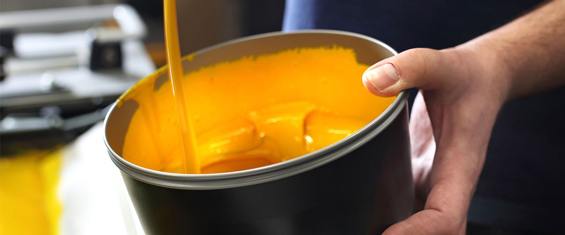 A tub of yellow offset printer ink